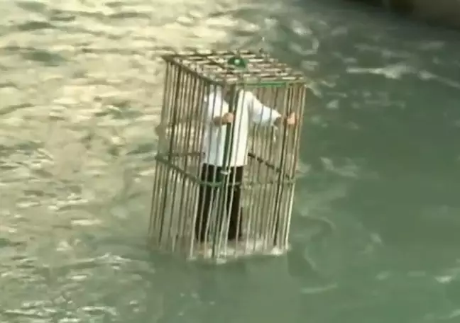 Town Punishes Its Politicians By Putting Them In A Cage In A River